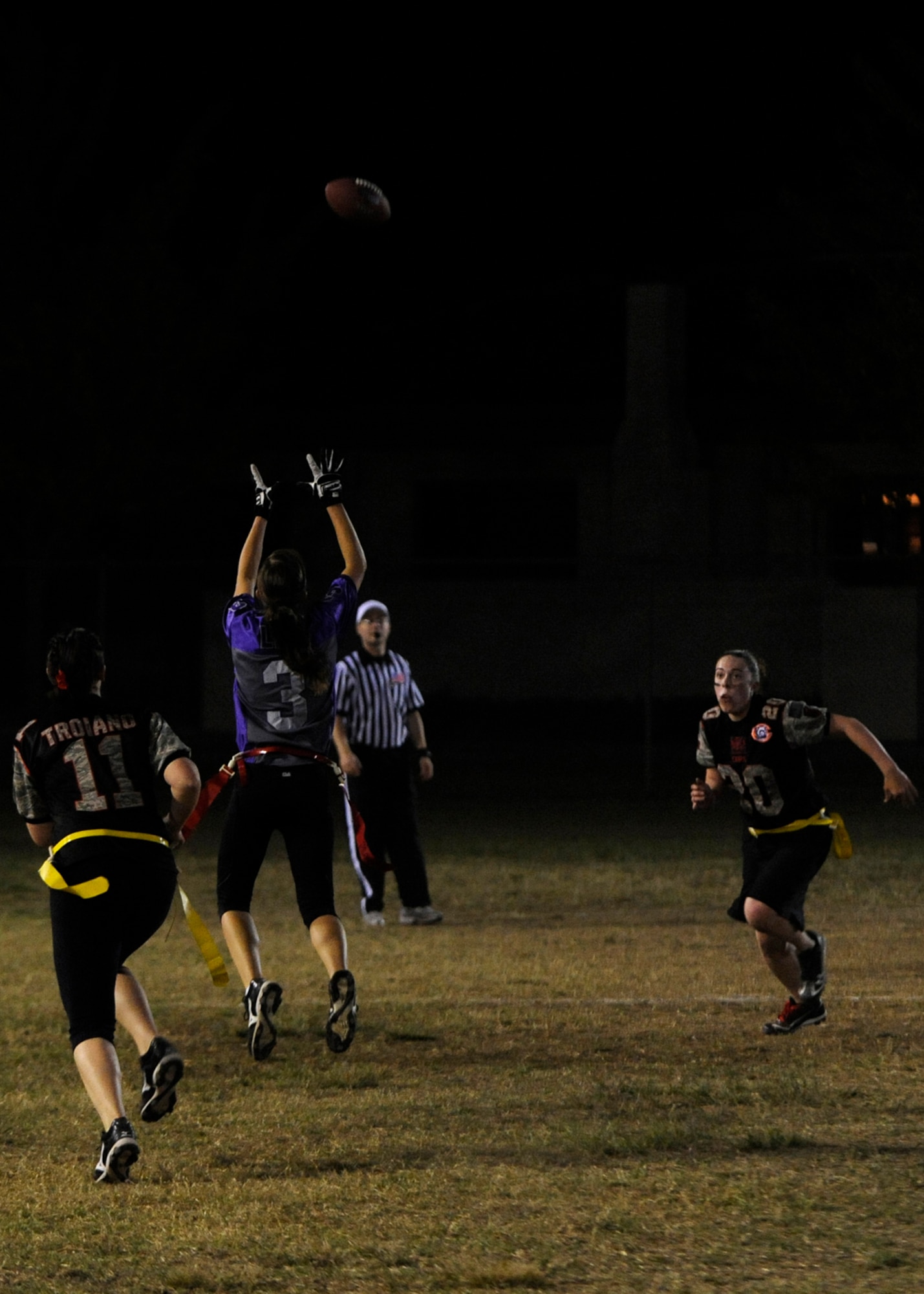 Lindsay Porath, 8th Medical Operations Squadron, Lady Med Dawgs reciever jumps up to catch the ball during the powder puff championship against 8th Security Forces Squadron Lethal Ladies at Kunsan Air Base, Republic of Korea, Oct. 20, 2012. The Lady Med Dawgs were able to beat the Lethal Ladies, 12-0 and 14-0 in back to back games to take first. (U.S. Air Force photo/Senior Airman Marcus Morris)