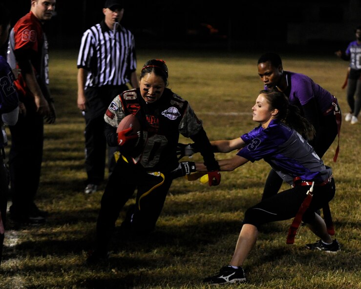 Janessa Dymond, 8th Security Forces Squadron, Lethal Ladies  receiver runs down the sideline after catching the ball during the championship game against 8th Medical Group, Lady Med Dawgs at Kunsan Air Base, Republic of Korea, Oct. 20, 2012. Dymond’s run got her team the first down and allowed them to score on the next play. (U.S. Air Force photo/Senior Airman Marcus Morris)