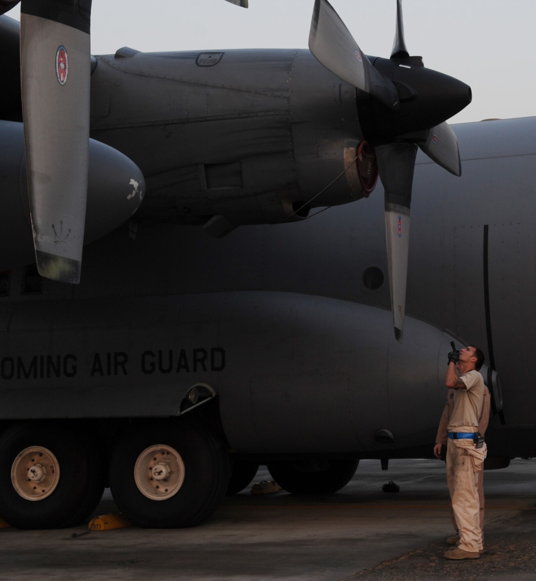 SOUTHWEST ASIA – Senior Airman Joseph Merriman, 386th Expeditionary Aircraft Maintenance Squadron crew chief, checks the exterior of a C-130 Hercules for damage after it lands here Oct. 23.  Between missions, maintainers feverishly perform pre- and post-flight inspections on the aircraft. (U.S. Air Force photo/Staff Sgt. Alexandra M. Boutte)
