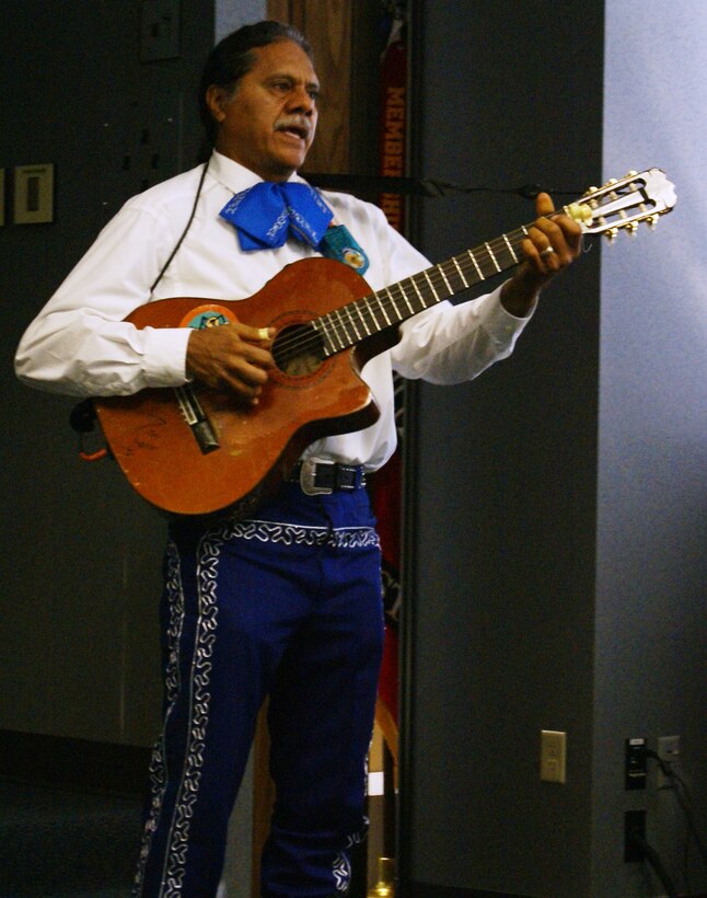 Jorge Rodriguez entertains attendees to the Hispanic History program held at the Tulsa District headquarters. 