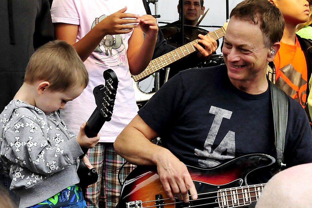 Gary Sinise and the Lt. Dan Band perform during Naval Medical Center San Diego's appreciation day for the hospital's staff, patients and families in San Diego, Oct. 20, 2012. The Gary Sinise Foundation hosted the event, which featured a performance by the band Stolen Silver, a barbecue lunch, appearances by the Cirque du Soleil Street Team, and special guests from the television show "CSI: NY." 