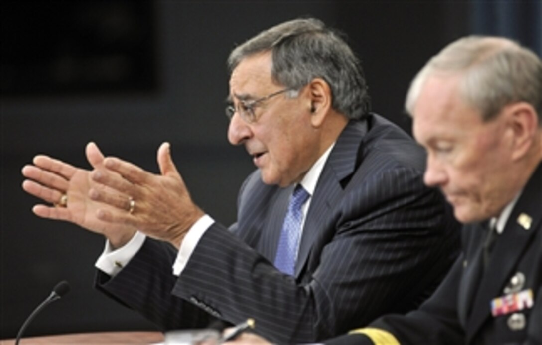 Secretary of Defense Leon E. Panetta gestures as he answers a reporter's question during a press conference with Chairman of the Joint Chiefs of Staff Gen. Martin E. Dempsey in the Pentagon on Oct. 25, 2012.  