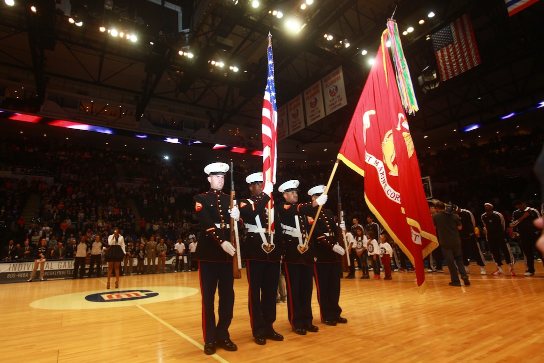Cpl. Caleb Gomez, Sgt. Malik King, Sgt. Mohamed Mohamed, and Sgt. Edwin Ramirez present the colors before a Brooklyn Nets vs.  New York Knicks game at Nassau Veterans Memorial Coliseum in Uniondale, N.Y., Oct. 24.  Gomez, from Temecula, Calif., King, from Hempstead, N.Y., and Mohamed and Ramirez, from New York, are members of the 1st Marine Corps District and are based in Garden City, N.Y.