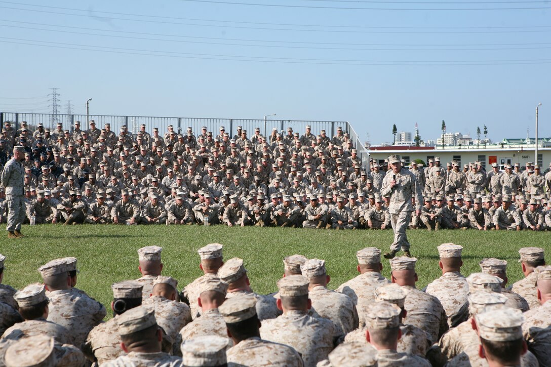 Lt. Gen. Kenneth J. Glueck, Jr. addresses Marines, sailors and civilians during an all-hands period of reflection brief at Camp Foster Oct. 25. “I have all the trust and confidence that we will overcome this period and continue to move forward,” said Glueck. “Every Marine on Okinawa became a diplomat the moment they landed on Okinawa. Conduct yourselves accordingly when interacting with our hosts and be the best diplomat you can be for our country and service.” Glueck plans to visit all Marine installations on island within the week to address recent alleged sexual assault incidents and the resulting liberty policy changes while emphasizing the role of service members as ambassadors on Okinawa. Glueck is the III Marine Expeditionary Force commanding general.