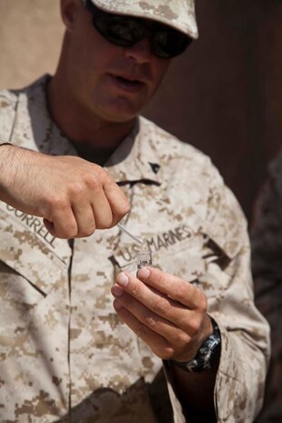 U.S. Marine Corps Cpl. Timothy R. Correll, a combat engineer with Sapper Platoon, 2nd Combat Engineer Battalion, 2nd Marine Division, demonstrates how to employ a small bulk homemade explosives precursor detection kit to Marines with Headquarters Company, Regimental Combat Team 7 as part of counter improvised explosive device (IED) training at Camp Leatherneck, Helmand province, Afghanistan, Oct. 15, 2012. The counter IED training familiarized the Marines with fundamentals to include: unexploded ordnance recognition, enemy tactics, homemade explosives, threat detection, ground signs awareness, and downed vehicle procedures. (U.S. Marine Corps photo by Cpl. Alejandro Pena/Released)