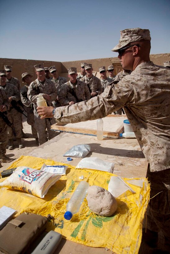 U.S. Marine Corps Cpl. Timothy R. Correll, right, a combat engineer with Sapper Platoon, 2nd Combat Engineer Battalion, 2nd Marine Division, teaches a class on homemade explosives to Marines with Headquarters Company, Regimental Combat Team 7 as part of counter improvised explosive device (IED) training at Camp Leatherneck, Helmand province, Afghanistan, Oct. 15, 2012. The counter IED training familiarized the Marines with fundamentals to include: unexploded ordnance recognition, enemy tactics, homemade explosives, threat detection, ground signs awareness, and downed vehicle procedures. (U.S. Marine Corps photo by Cpl. Alejandro Pena/Released)