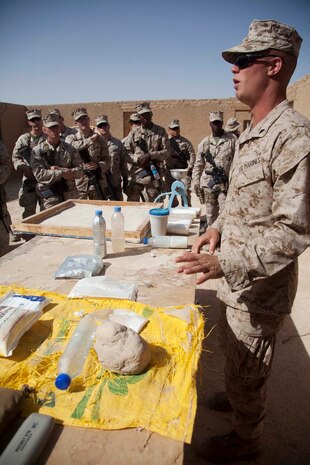 U.S. Marine Corps Cpl. Timothy R. Correll, right, a combat engineer with Sapper Platoon, 2nd Combat Engineer Battalion, 2nd Marine Division, teaches a class on homemade explosives to Marines with Headquarters Company, Regimental Combat Team 7 as part of counter improvised explosive device (IED) training at Camp Leatherneck, Helmand province, Afghanistan, Oct. 15, 2012. The counter IED training familiarized the Marines with fundamentals to include: unexploded ordnance recognition, enemy tactics, homemade explosives, threat detection, ground signs awareness, and downed vehicle procedures. (U.S. Marine Corps photo by Cpl. Alejandro Pena/Released)