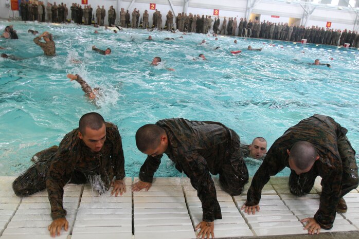 Recruits of Company I, 3rd Recruit Training Battalion, have their swimming skills assesed during a 25-meter swim aboard Marine Corps Recruit Depot San Diego Oct. 22. After being categorized as either a strong or weak swimmer, recruits were either taught how to become better swimmers or advance water survival techniques. One of the techniques showed recruits how to use their cammies as a flotation device.