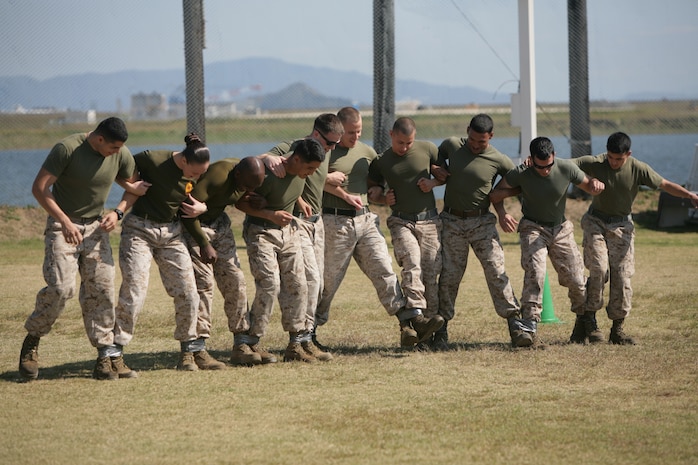 A Gladiator's Cup challenge team competes in the ten-legged race during the Commander's Cup's final event, the Gladiator Cup challenge, which took place at Penny Lake fields here Oct. 19, 2012. The Gladiator's Cup was an all-day, multi-disciplined evolution and teams received points based on their placement in each event. At the end of the day, officials totaled each team's points for the day to decide the victor.