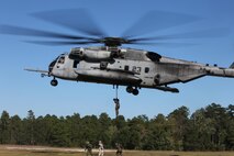 Marines from 2nd Radio Battalion fast rope out of a CH-53E Super Stallion from Marine Heavy Helicopter Squadron 461, Oct. 16. Fast roping is a way Marines can quickly exit a helicopter without requiring the aircraft to land. 