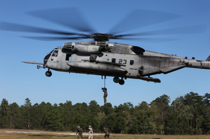 Marines from 2nd Radio Battalion fast rope out of a CH-53E Super Stallion from Marine Heavy Helicopter Squadron 461, Oct. 16. Fast roping is a way Marines can quickly exit a helicopter without requiring the aircraft to land. 