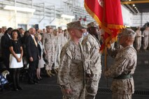 Lt. Col. Brian McAvoy recieves the colors of Marine Medium Tiltrotor Squadron 264 from Sgt. Maj. George Aurelio, VMM-264 sergeant major, during a change of command ceremony at the squadron's hangar, Oct. 19. McAvoy gave command of the Squadron to Lt. Col. Douglas C. Sanders.