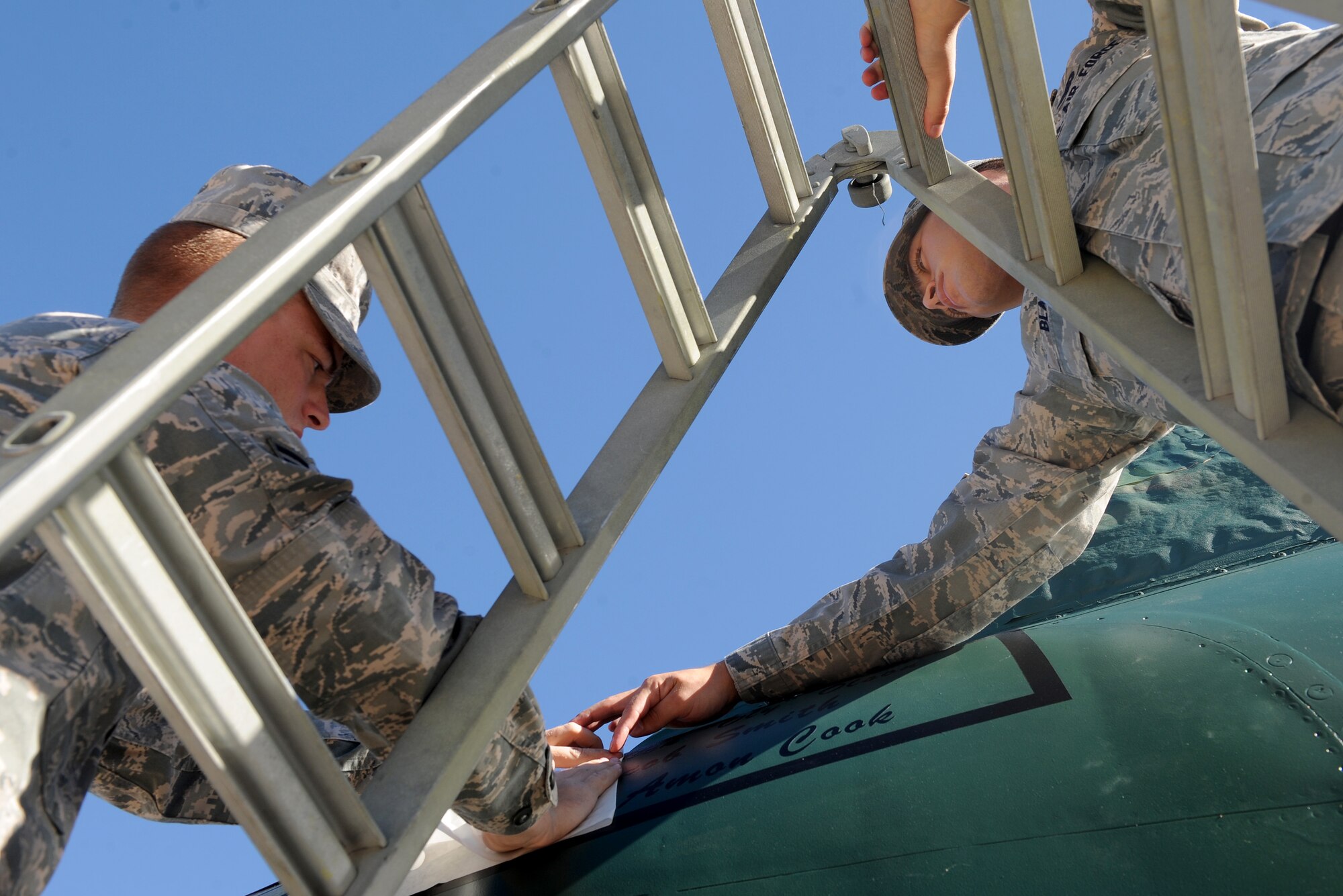 U.S. Air Force Airman 1st Class Rodney Bush, 355th Equipment Maintenance Squadron aircraft structural maintenance apprentice, paints an A-10 Thunderbolt II during the refurbishment at Heritage Park on Davis-Monthan Air Force Base, Ariz., Oct. 24, 2012. The aircraft at Heritage Park are repainted every three to four years. (U.S. Air Force photo by Senior Airman Brittany Dowdle/released)