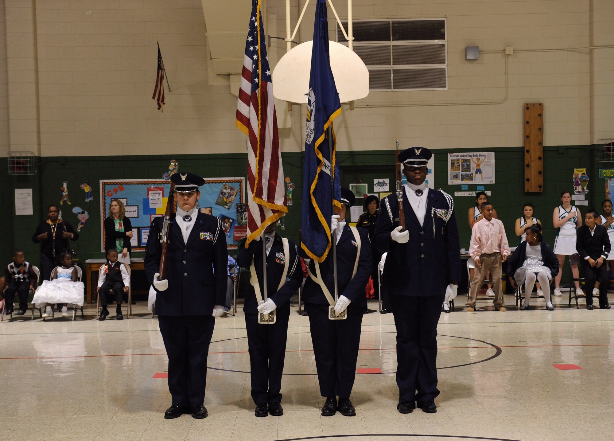 Students from Bossier High School Junior Reserve Officers' Training Corps post the colors during a Red Ribbon Week assembly at Bossier Elementary School, Bossier City, La., Oct. 26. Red Ribbon Week is dedicated to inform the community on the dangers of drug and alcohol abuse. Members of Team Barksdale attended the assembly to show their support for the local community. (U.S. Air Force photo/Airman 1st Class Benjamin Gonsier)(RELEASED)
