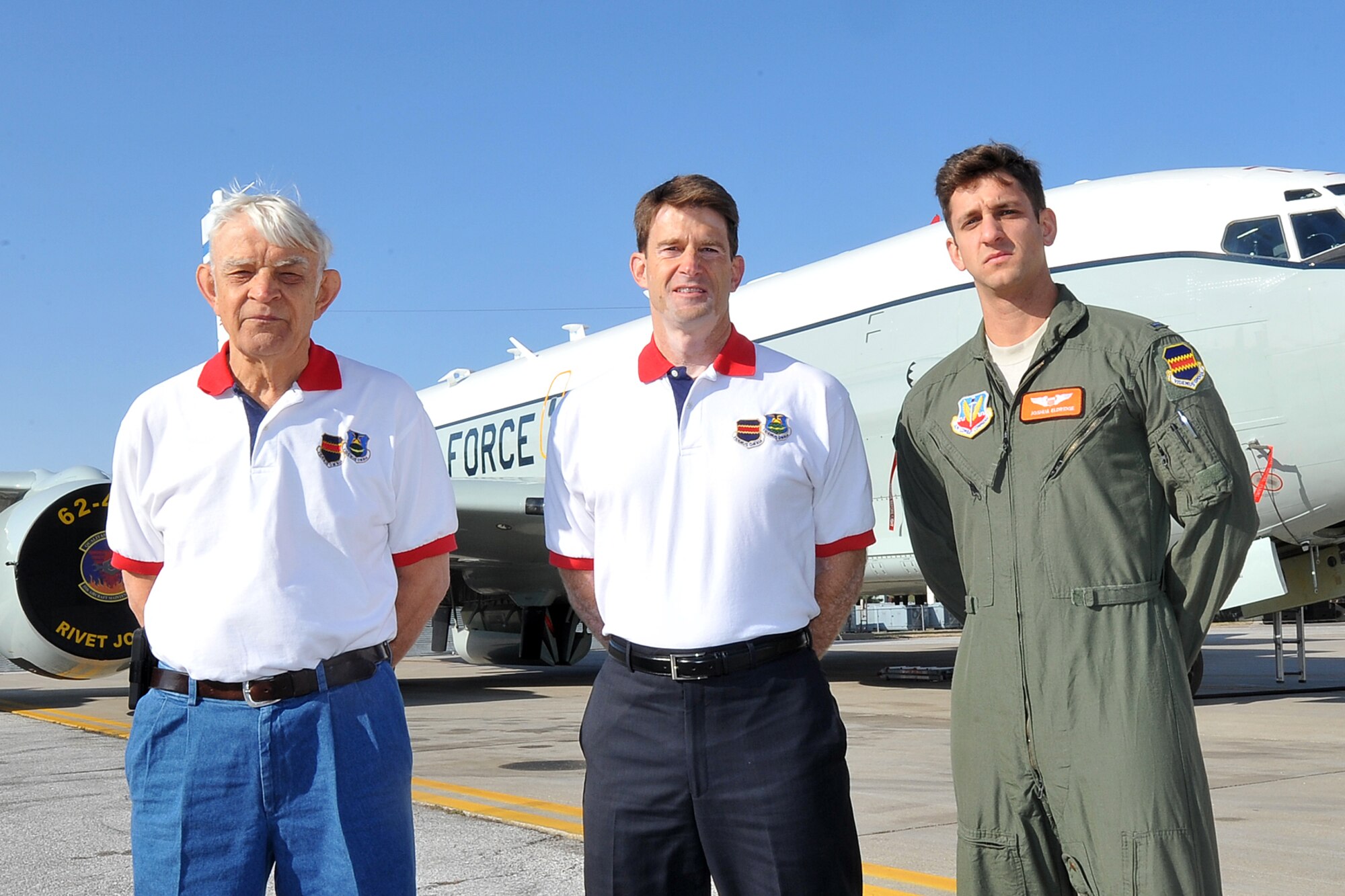 The Eldridge family, retired U.S. Air Force Lt. Col. Golda T. Eldridge Sr. (Left), retired U.S. Air Force Lt. Col. Golda T. Eldridge Jr. (Center) and U.S. Air Force 1st Lt. Joshua Eldridge (Right) stand next to an RC-135V/W Rivet Joint. The Eldridge family is the first to have a third generation pilot become part of the 55th Wing at Offutt Air Force Base.