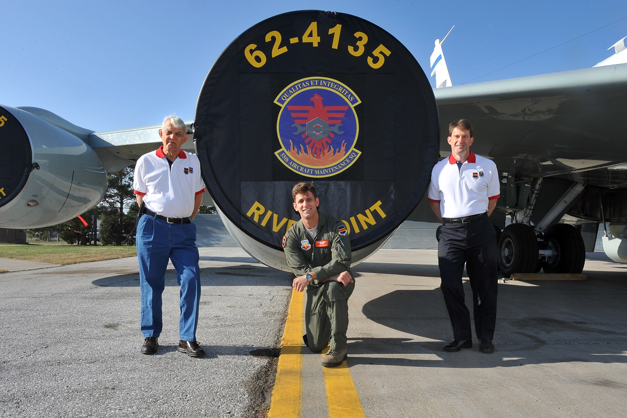 The Eldridge family, retired U.S. Air Force Lt. Col. Golda T. Eldridge Sr. (Left), U.S. Air Force 1st Lt. Joshua Eldridge (Center) and retired U.S. Air Force Lt. Col. Golda T. Eldridge Jr. (Right) stand next to an RC-135V/W Rivet Joint. The Eldridge family is the first to have a third generation pilot become part of the 55th Wing at Offutt Air Force Base.
