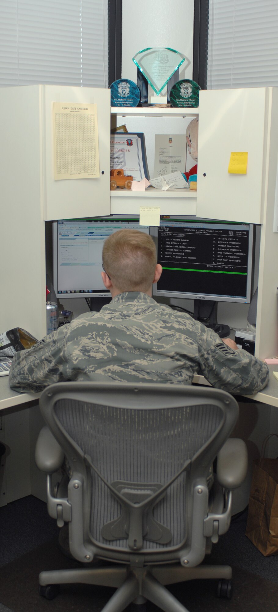 U.S. Air Force Staff Sgt. Matthew Harper, 355th Comptroller Squadron accounting noncommissioned officer in charge, works at his computer on Davis-Monthan Air Force Base, Ariz., Oct. 25. The financial management analysis flight section of the 355th CPTS provides sound financial support to the 355th Fighter Wing and other units. (U.S. Air Force photo by Senior Airman Michael Washburn/Released)