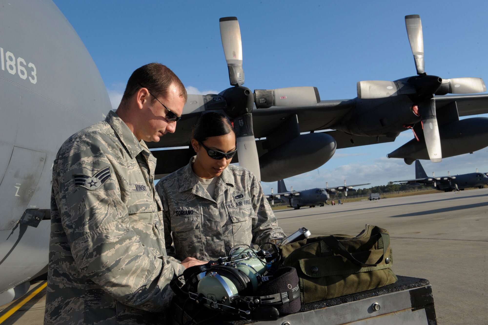 U.S. Air Force Senior Airman Matthew Vinsky and Airman 1st Class Erin Soriano, both from the 723d Aircraft Maintenance Squadron, conduct a system check on an HC-130 Combat King during routine maintenance Oct. 25, 2012, at Moody Air Force Base, Ga. Along with performing everyday continuation care on the aircraft, most Airmen are preparing for the upcoming Open House air show that takes place at Moody Oct. 27 – 28. (U.S. Air Force photo by Senior Airman Eileen Meier/Released)  