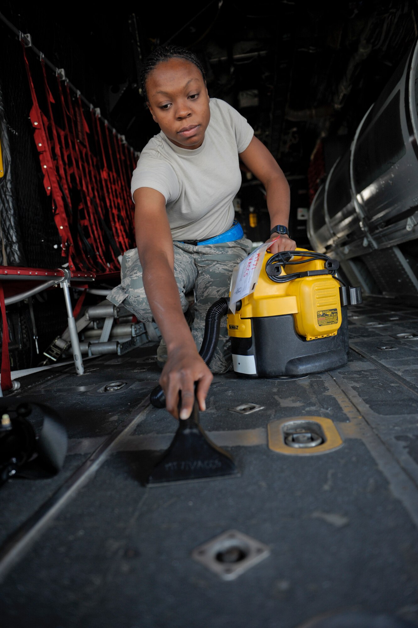 U.S. Air Force Airman 1st Class Kendalla Gipson, 723d Aircraft Maintenance Squadron, vacuums the flooring of an HC-130 Combat King Oct. 25, 2012, at Moody Air Force Base, Ga.. The aircraft is scheduled to be on display during the Open House taking place Oct. 27-28. In addition to the last few spit shines on the aircraft, members of the 723d AMXS are also conducting a 14-day isochronal inspection along with preparing a C-130 for transportation to the Davis Monthan AFB, Ariz., “Boneyard.” (U.S. Air Force photo by Senior Airman Eileen Meier/Released)