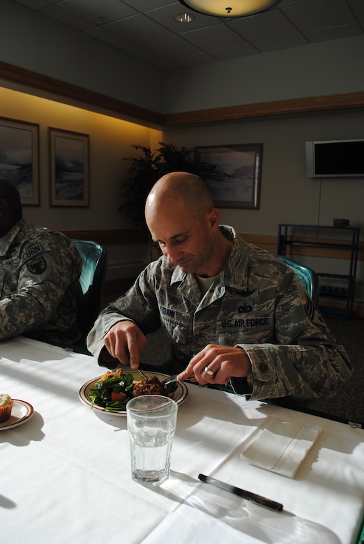 Chief Master Sgt. Frank Fidani, 341st Missile Wing command chief, tests crusted chicken with pumpkin during the 3rd Quarter Warrior Chef Competition at the Elkhorn Dining Facility on Oct. 15. Fidani, along with Chief Master Sgt. Brian Hornback, Air Force Global Strike Command command chief, and Command Sgt. Major Patrick Alston, U.S. Strategic Command senior enlisted leader, were the three judges of the competition. (U.S. Air Force photo/Airman 1st Class Katrina Heikkinen)