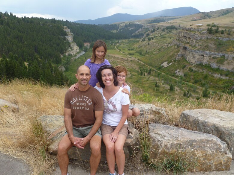 Chief Master Sgt. Frank Fidani, 341st Missile Wing command chief, his wife Ellen, and their two children Massimo, 9, and Francesca, 6, post for a photo overlooking Sluice Boxes State Park near Neihart. Fidani is Malmstrom’s newest command chief and assumed the position in August. (U.S. Air Force courtesy photo)