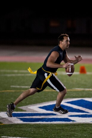 Staff Sgt. Michael Gongora, 99th Civil Engineer Squadron fire protection craftsman, runs toward the end zone Oct. 22, 2012, at Nellis Air Force Base, Nev.  The firedogs won 13-12 in their game against Public Affairs. (U.S. Air Force photo by Airman 1st Class Jason Couillard)