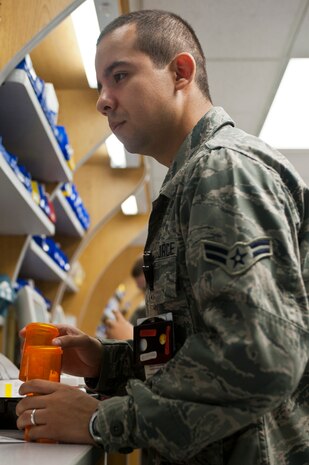 Airman 1st Class Victor Rodriguez, 99th Medical Support Squadron pharmacy technician apprentice, fills a prescription Oct. 23, 2012, at Nellis Air Force Base, Nev. The Nellis AFB satellite pharmacy is open 7 a.m. – 5 p.m., Monday through Friday. (U.S. Air Force photo by Airman 1st Class Jason Couillard)