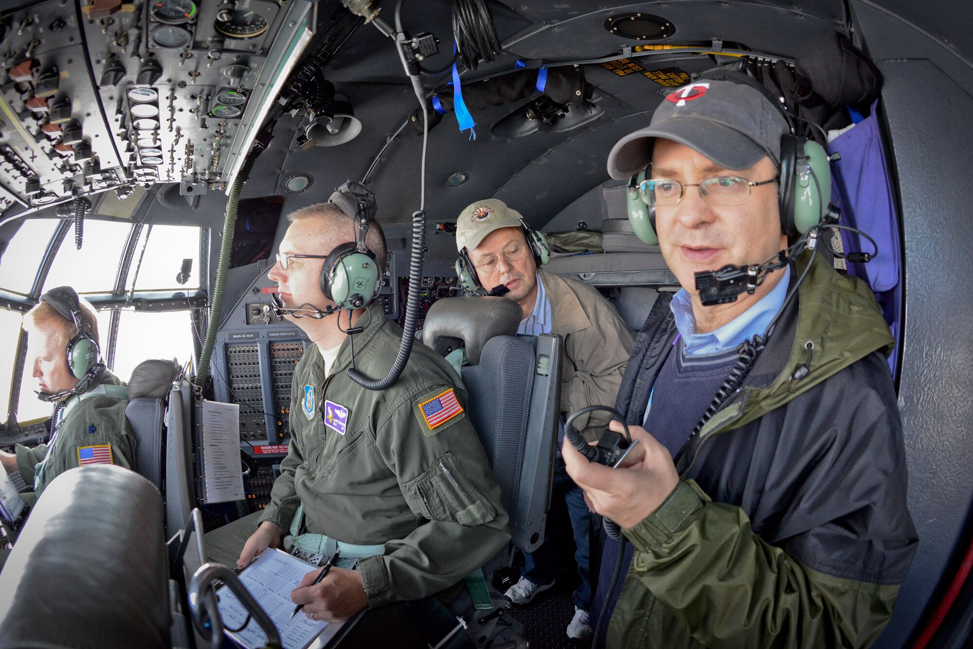 Brian Grubbs and Scott Pollock enjoy the view from the flight deck and learn about the aircraft.  Civic leaders and clergy members from the local area participated in an orientation flight with the 934th Airlift Wing October 25.  (U.S. Air Force Photo/Shannon McKay)