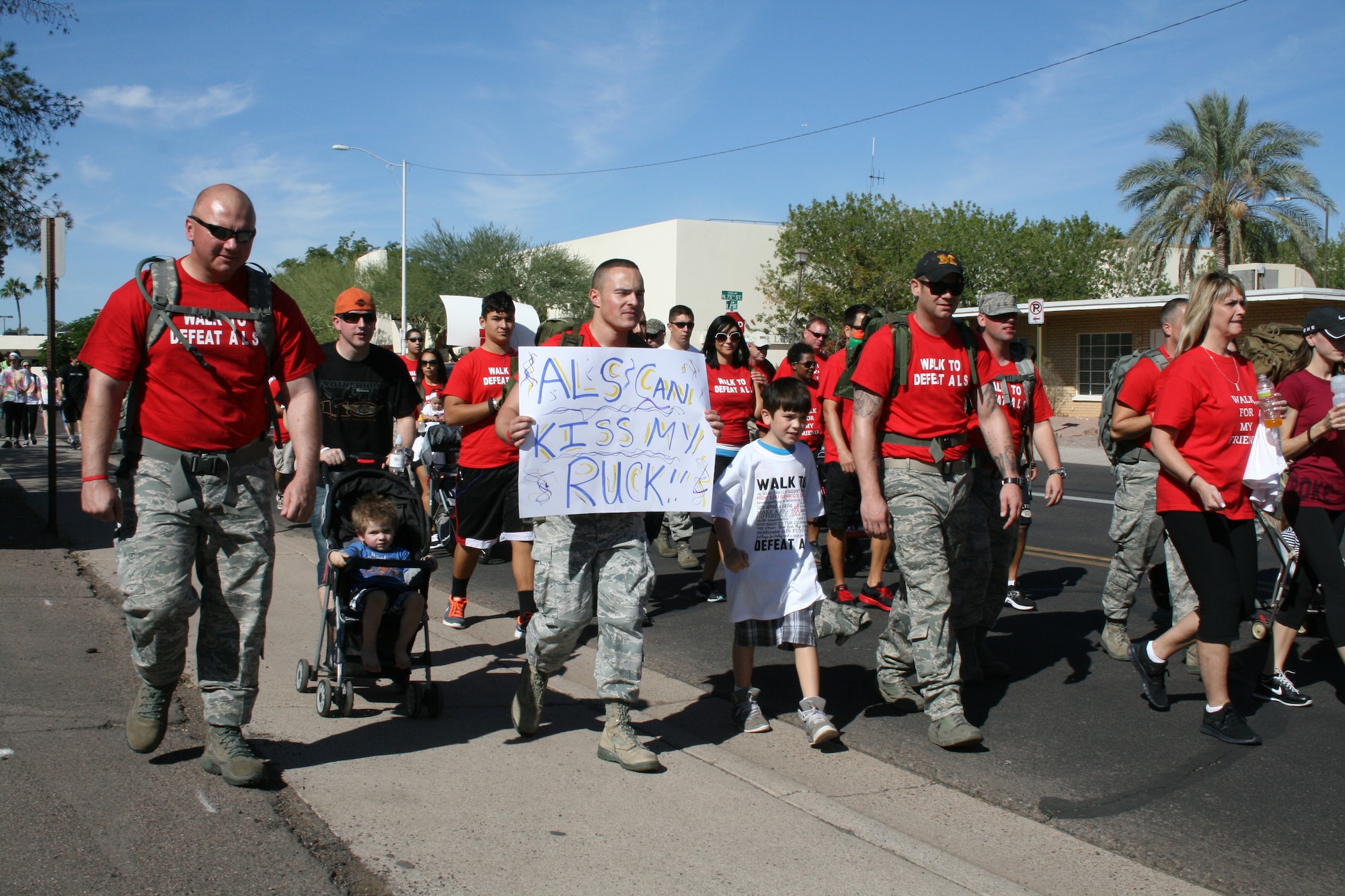 Luke Air Force Base Thunderbolts walk in honor of retired 56th Security Forces Squadron Master Sgt. Evelyn Proctor at the Walk to Defeat Amyotrophic Lateral Sclerosis, also known as Lou Gehrig’s disease Saturday in Scottsdale. The Thunderbolts raised a total of $2,823.12 for the cause and “rucked” the 3-mile walk.  (U.S. Air Force photo by Airman 1st Class Grace Lee)