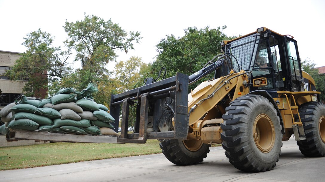 Sandbags are transported by the 633rd Civil Engineer Squadron to help prevent flooding during Hurricane Sandy at Langley Air Force Base, Va., Oct. 26, 2012. Significant impacts from Sandy could potentially begin as early as 2 a.m., Oct. 29, 2012. (U.S. Air Force photo by Airman 1st Class Teresa Aber/Released)
