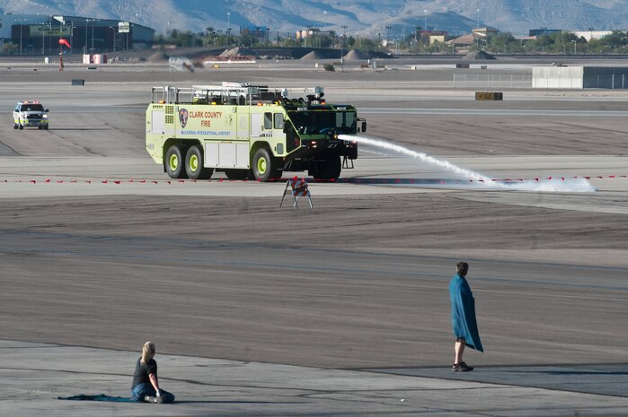 The Clark County fire department responds to an emergency preparedness exercise at McCarran International Airport Oct. 24, 2012, ,in Las Vegas. One of the reasons the Clark County Department of Aviation conducts these exercises is to meet or exceed the requirements set forth by the Federal Aviation Administration. (U.S. Air Force photo by Airman 1st Class Jason Couillard)