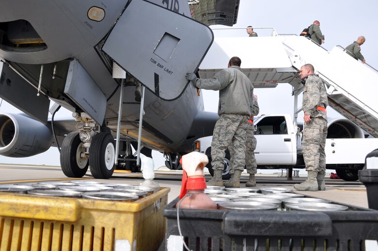 Members of the Air Force Reserve 931st Aircraft Maintenance Squadron prepare to climb the ladder into a KC-135 Stratotanker at McConnell Air Force Base, Kan., Oct. 22, 2012.  The aircraft had just returned from an overseas mission.  The Airmen assigned to the 931st Aircraft Maintenance Squadron are part of a team that accomplishes a lengthy checklist of items to ensure McConnell's fleet of tankers stay mission ready.  (U.S. Air Force photo by 1st Lt. Zach Anderson)
