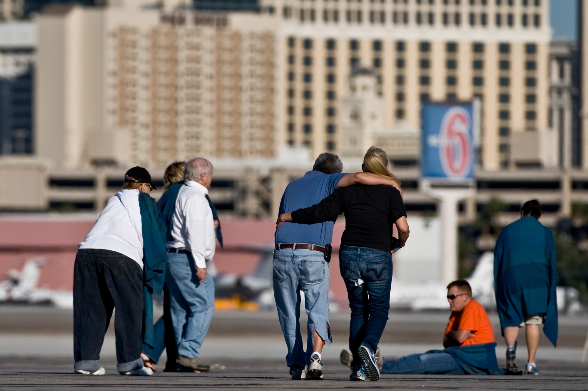Nellis Airmen and volunteers walk to safety during the 2012 Triennial Emergency Preparedness Exercise conducted by the Clark County Department of Aviation at McCarran International Airport Oct. 24, 2012, in Las Vegas, Nev. More than 100 volunteers acted as casualties for the mass casualty exercise. (U.S. Air Force photo by Senior Airman Daniel Hughes)
