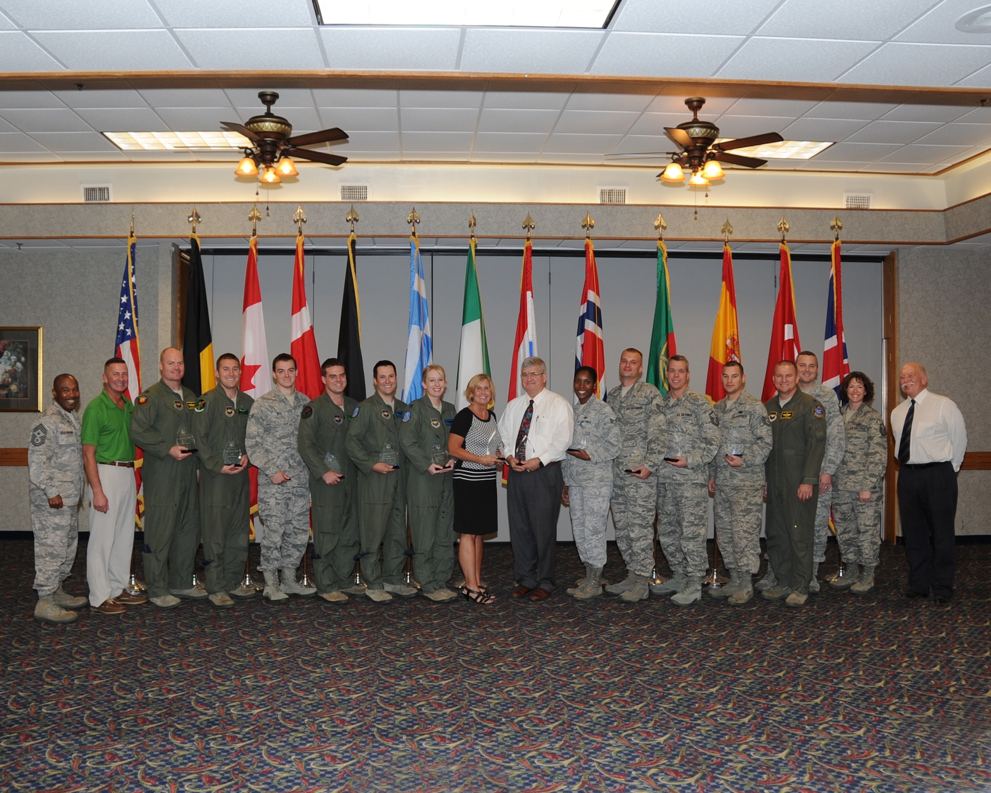 Col. Jaime Schofield (fourth from right), 80th Flying Training Wing vice commander, and Chief Master Sgt. Phillip Jelks-Browning (far left), 80th FTW command chief, presented the 80th FTW quarterly awards Oct. 24 at Sheppard Air Force Base, Texas. Winners were honored during a ceremony at the Sheppard Club (U.S. Air Force Photo/Felton Joshua)