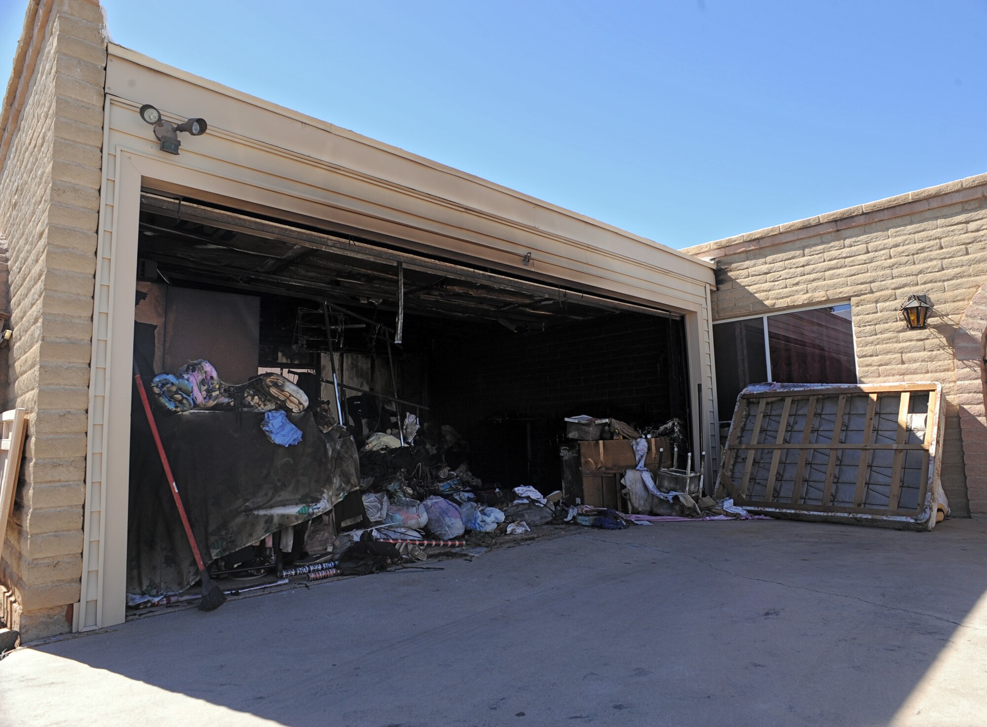 A garage stands scorched days after a fire Staff Sgt. Christopher Cacopardo, 923rd Aircraft Maintenance Squadron, saved residents from in Tucson, Ariz., Oct. 25, 2012. The fire broke out due to a broken surge protector inside the garage. (U.S. Air Force photo by Airman 1st Class Christine Griffiths/Released)

