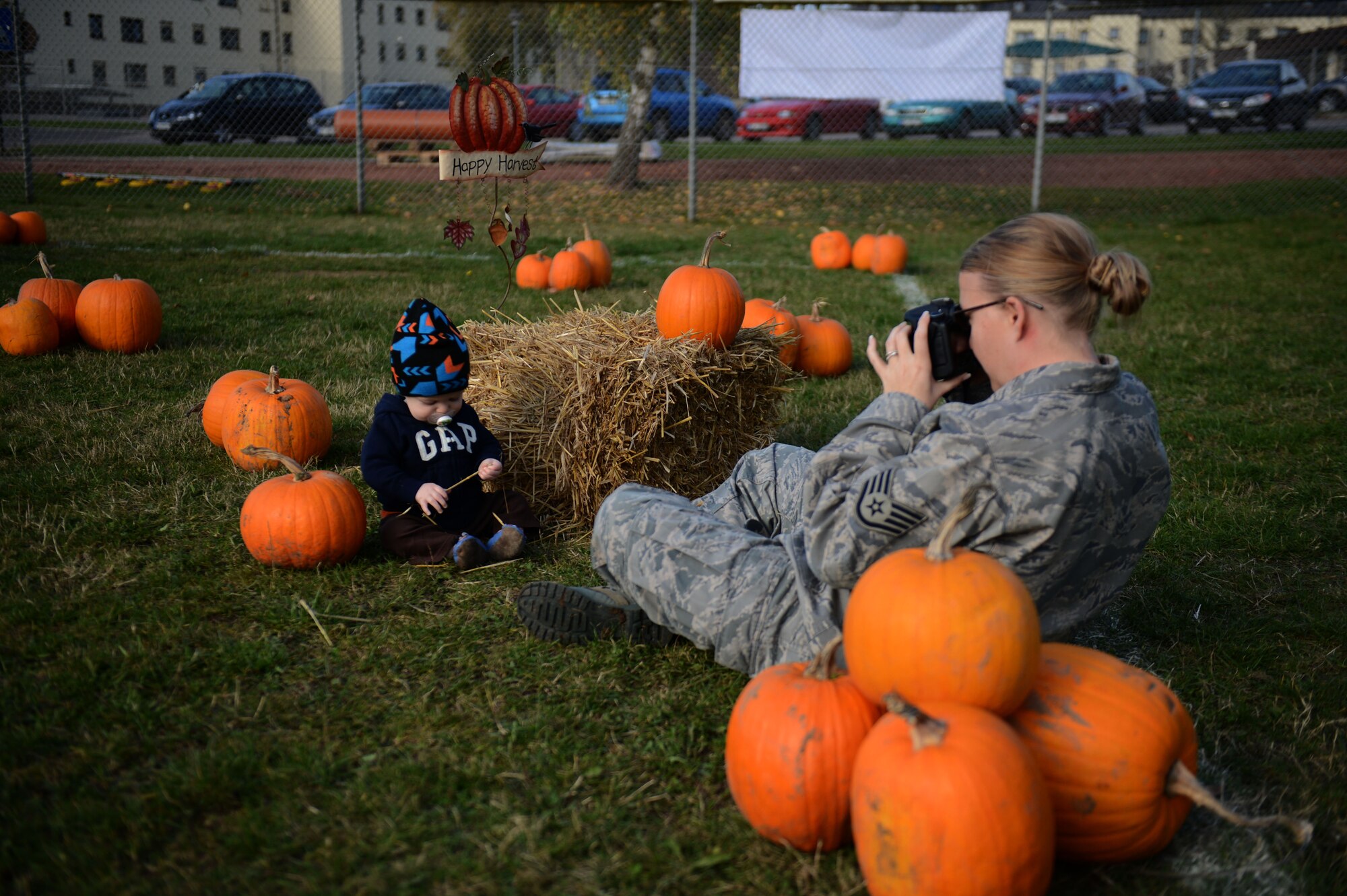 SPANGDAHLEM AIR BASE, Germany – U.S. Air Force Staff Sgt. Wendy Dupre, 52nd Communications Squadron client systems evaluator from Douglas, Ga., takes a photo of her son Maddox in a soccer field near the child development center during a pumpkin patch event Oct. 25, 2012.  The event encouraged a learning experience for the children through active parent involvement while incorporating the Halloween spirit. (U.S. Air Force photo by Airman 1st Class Gustavo Castillo/Released)