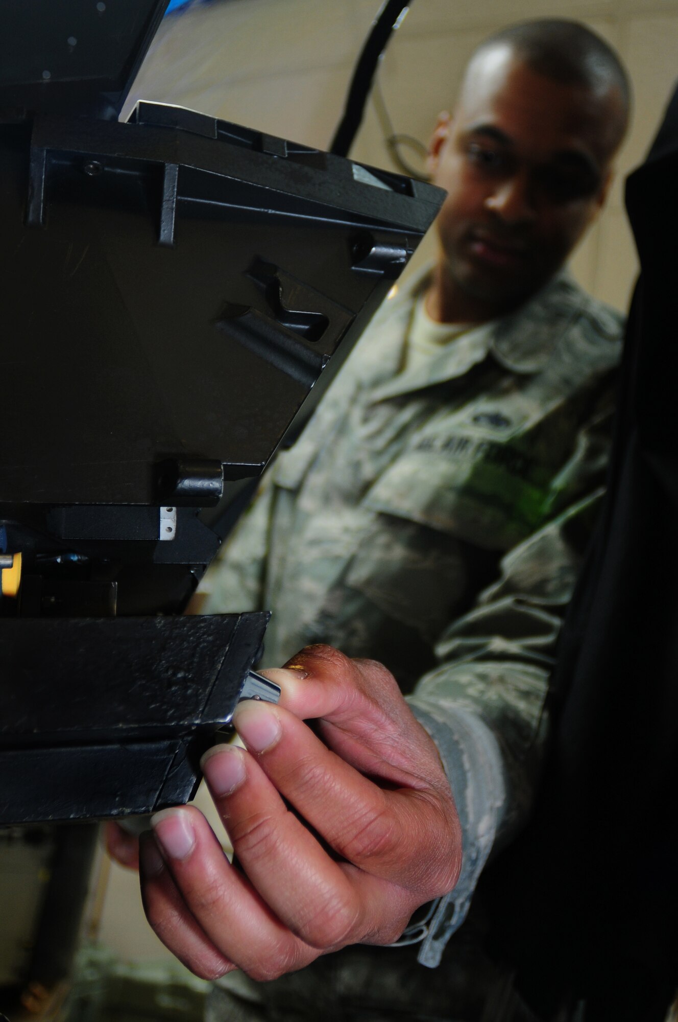 ROYAL AIR FORCE LAKENHEATH, England – Staff Sgt. Shannon Jones, 48th Component Maintenance Squadron avionics intermediate shop team leader, tests a Wide Field of View Heads-Up-Display Oct. 25, 2012. The avionics intermediate shop recently achieved 100% functionality on all test equipment. Airmen from the 48th CMS avionics intermediate section provide highly effective and efficient intermediate support to maintain the electronics on the F-15s. (U.S. Air Force photo by Airman 1st Class Cory D. Payne)