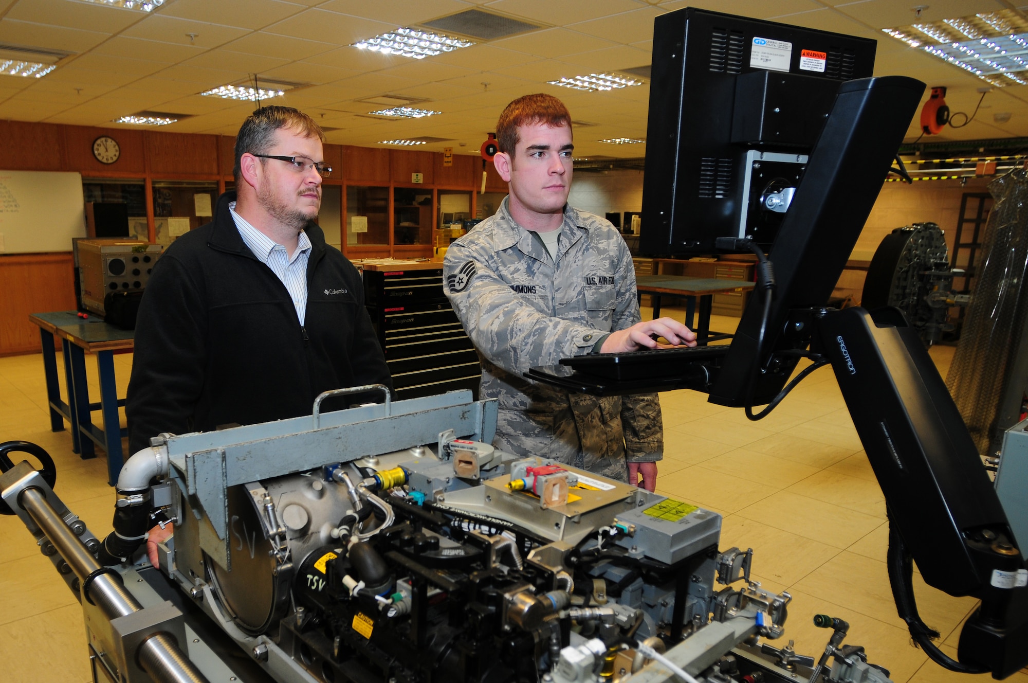 ROYAL AIR FORCE LAKENHEATH, England – Dan Foraker (left), 48th Component Maintenance Squadron avionics equipment specialist, and Staff Sgt. Joshua Simmons, 48th Component Maintenance Squadron avionics team leader, tests equipment Oct. 25, 2012. The avionics intermediate shop recently achieved 100% functionality on all test equipment. Airmen from the 48th CMS avionics intermediate section provide highly effective and efficient intermediate support to maintain the electronics on the F-15s. (U.S. Air Force photo by Airman 1st Class Cory D. Payne)