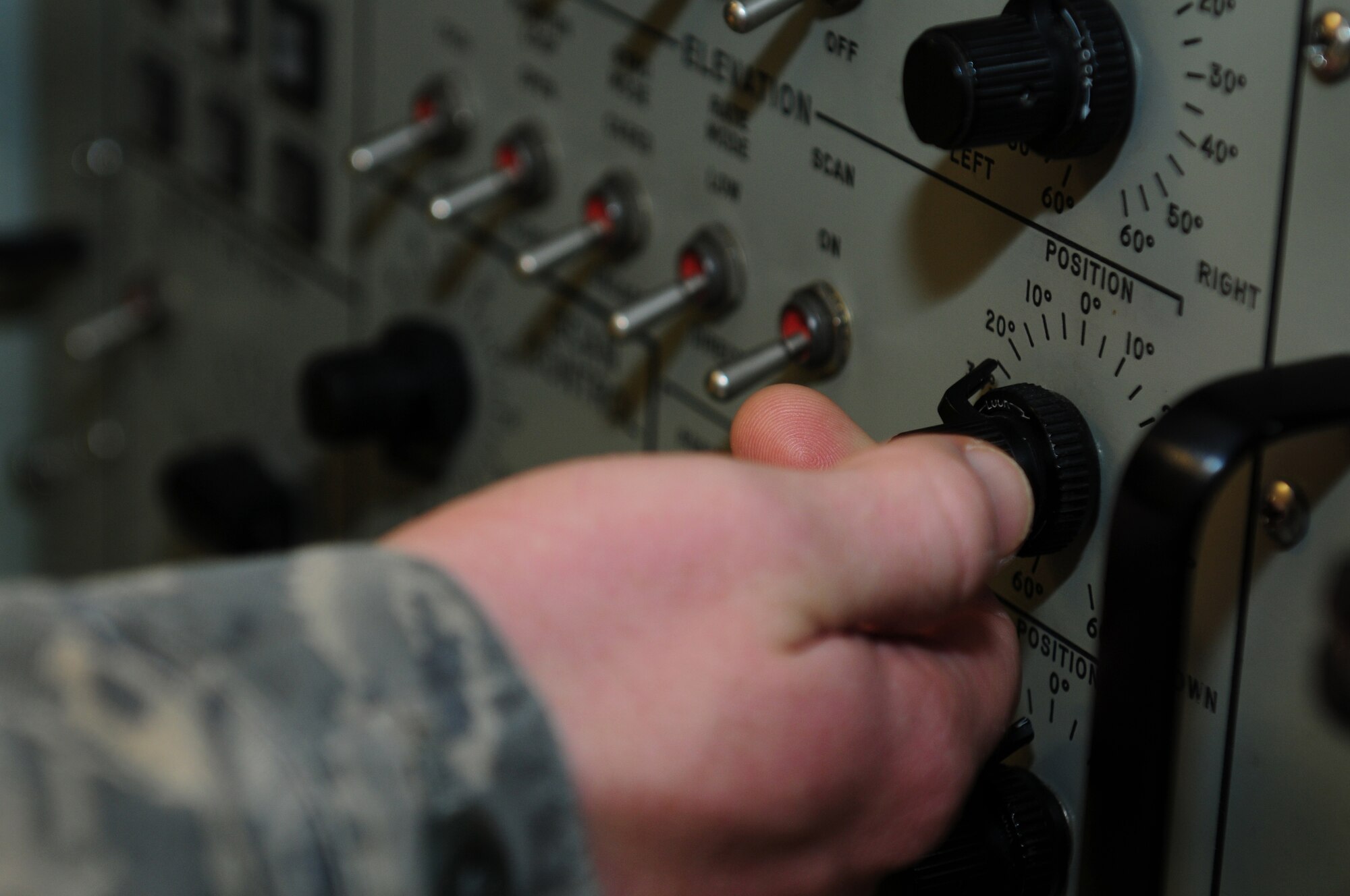 ROYAL AIR FORCE LAKENHEATH, England – Staff Sgt. Joshua Simmons, 48th Component Maintenance Squadron avionics team leader, adjusts a dial during a testing of an F-15 antenna Oct. 25, 2012. The avionics intermediate shop recently achieved 100% functionality on all test equipment. Airmen from the 48th CMS avionics intermediate section provide highly effective and efficient intermediate support to maintain the electronics on the F-15s. (U.S. Air Force photo by Airman 1st Class Cory D. Payne)