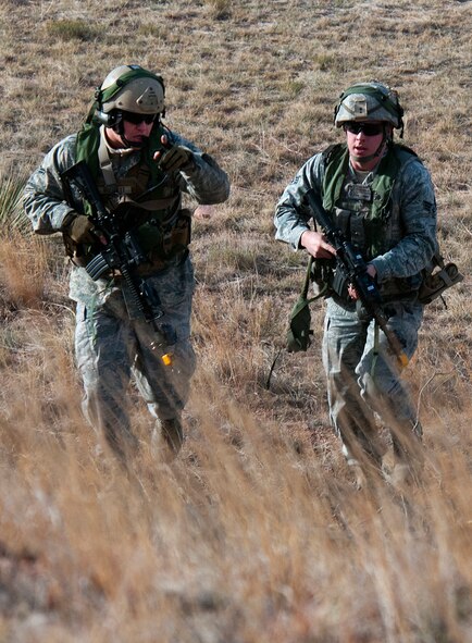 Airmen of F. E. Warren’s 790th Missile Security Forces Squadron maneuver as they engage opposition forces during Road Warrior X, a training exercise conducted by the 620th Ground Combat Training Squadron at Camp Guernsey, Wyo., Oct. 19. The F. E. Warren Air Force Base squadron took part in the exercise which trained Airmen of the 20th Air Force missile wings in the defense of nuclear assets should they come under attack while being transported in convoys. (U.S. Air Force photo by R.J. Oriez)