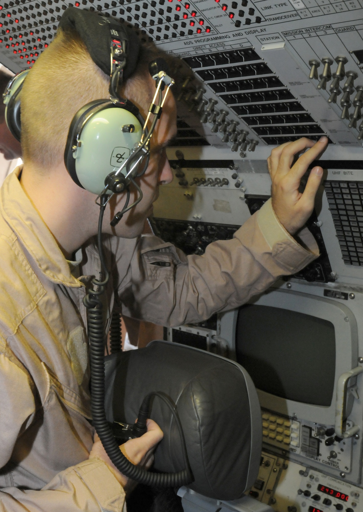 SOUTHWEST ASIA - U.S. Air Force Senior Airman Mark Hubert, 970th Expeditionary Airborne Air Control Squadron communications systems operator, tests radio communication on an E-3 Sentry before a training flight Oct. 24, 2012. The E-3, an Airborne Warning and Control System aircraft, which provides an airborne command and control capability. (U.S. Air Force photo/Tech. Sgt. Amanda Savannah)