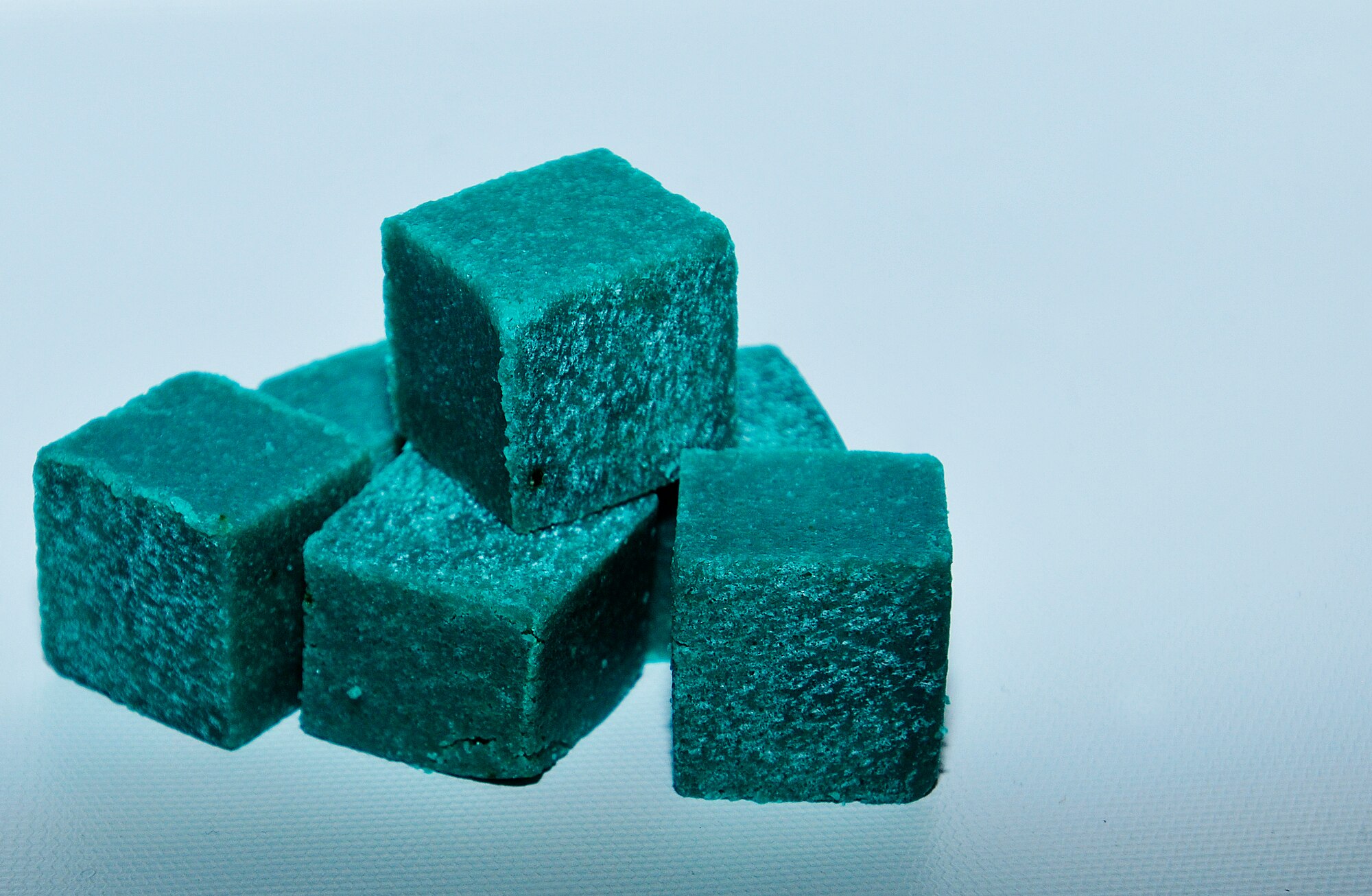 ROYAL AIR FORCE LAKENHEATH, England - Microbial waterless urinal cubes, solo-cubes, are slated to be used in all 500 urinals around base to replace the use of water. The cubes feed on salt in urine and scale built up in the pipes. The initiative is to save the base $400,000 and 20 million gallons of water annually. (U.S. Air Force photo by Senior Airman Tiffany M. Grigg) 