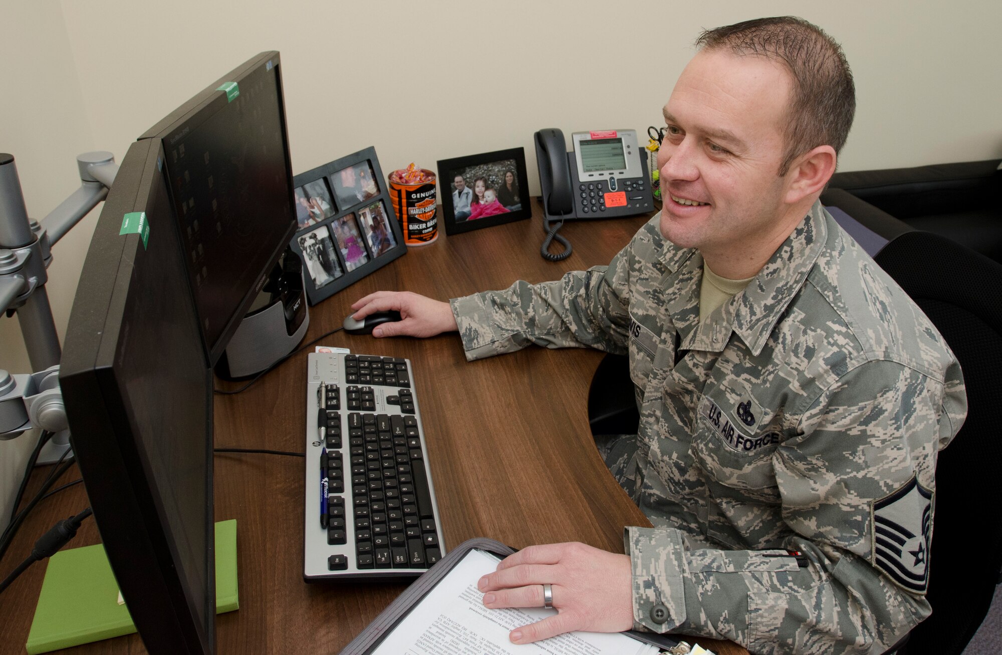 ROYAL AIR FORCE LAKENHEATH, England - Master Sgt. Christopher Davis, 493rd Aircraft Maintenance Unit lead production superintendent and native of Grenada, Miss., works at his desk Oct. 23, 2012. Davis was recently awarded the Gen. Lew Allen Jr. Trophy. The trophy is awarded annually to a base-level officer and senior NCO in the aircraft, munitions or missile maintenance fields directly involved in sortie generation. (U.S. Air Force photo by Staff Sgt. Stephen Linch)