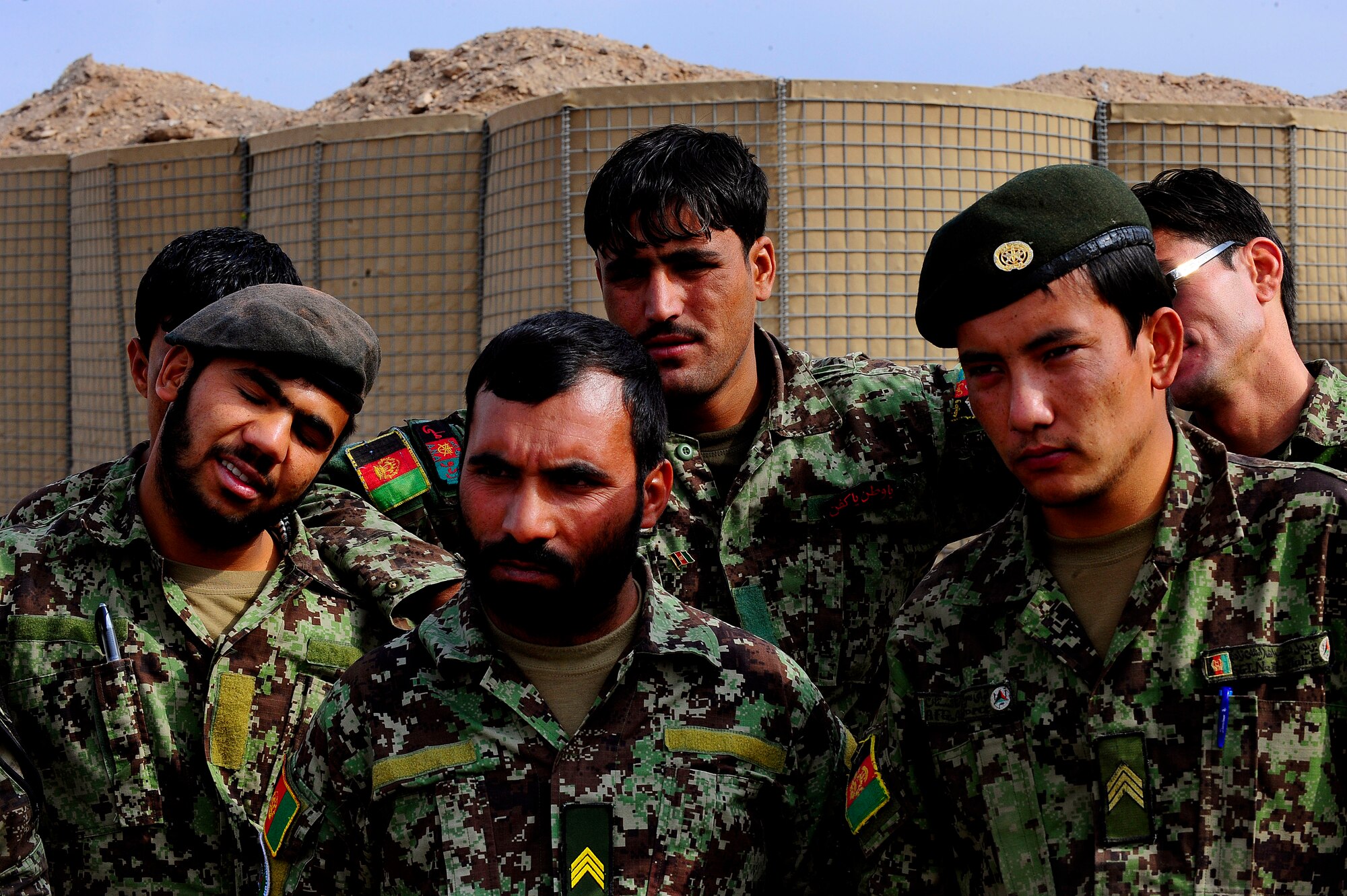 Afghan Air Force Security Forces members listen to the debrief after field training, Oct. 18, 2012, at Shindand Air Base, Afghanistan. This was an initial security and tactical training culmination exercise for the Shindand Air Wing Security Forces. (U.S. Air Force photo/ Tech. Sgt. Quinton Russ/RELEASED)