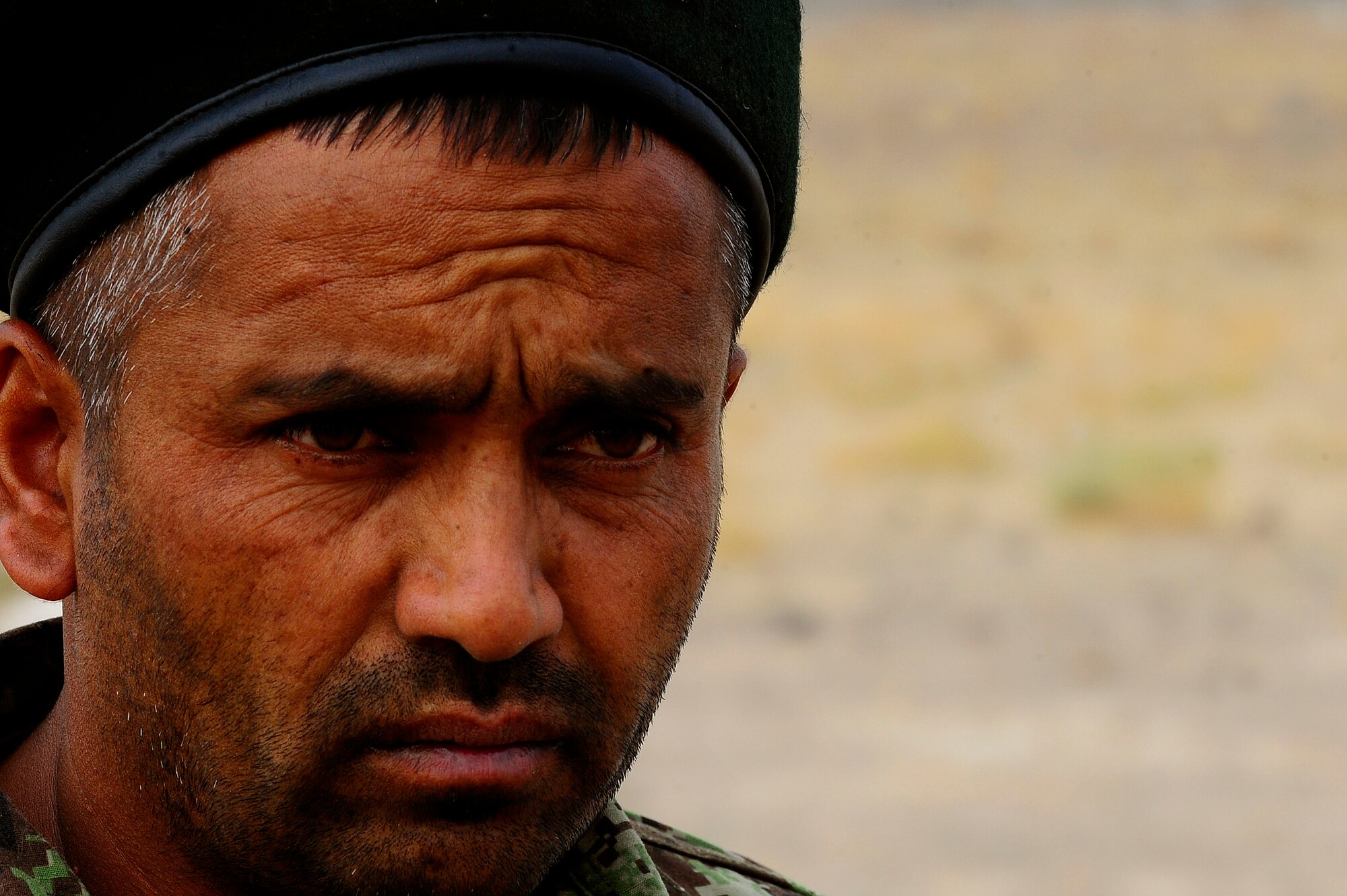 Afghan Air Force Security Forces Lt. Abdul Wasi listens to the debrief of a field training exercise, Oct. 18, 2012, at Shindand Air Base, Afghanistan. This was an initial security and tactical training culmination exercise for the Shindand Air Wing Security Forces. (U.S. Air Force photo/ Tech. Sgt. Quinton Russ/RELEASED)