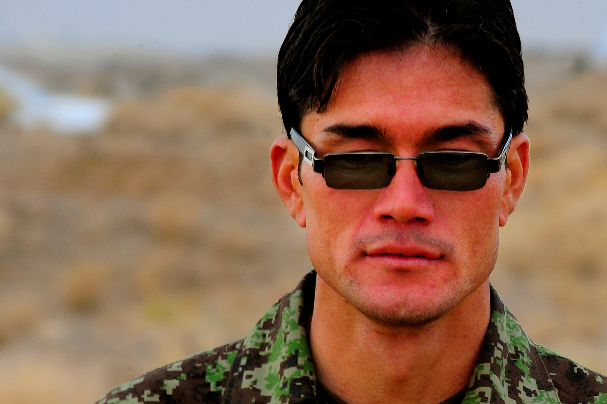 Afghan Air Force Security Forces Soldier Qasim listens to the debrief of a field training exercise, Oct. 18, 2012, at Shindand Air Base, Afghanistan. This was an initial security and tactical training culmination exercise for the Shindand Air Wing Security Forces. (U.S. Air Force photo/ Tech. Sgt. Quinton Russ/RELEASED)