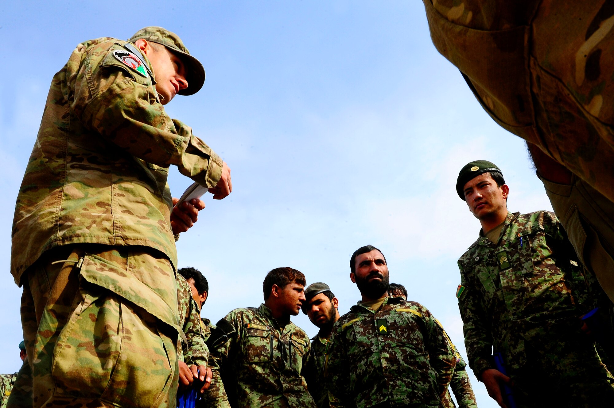 U.S. Air Force Tech. Sgt. Dwayne Bazinet, Security Forces advisor, gives a debrief to Afghan AF Security Forces after their field training exercise, Oct. 18, 2012, at Shindand Air Base, Afghanistan. This was an initial security and tactical training culmination exercise for the Shindand Air Wing Security Forces. (U.S. Air Force photo/ Tech. Sgt. Quinton Russ/RELEASED)