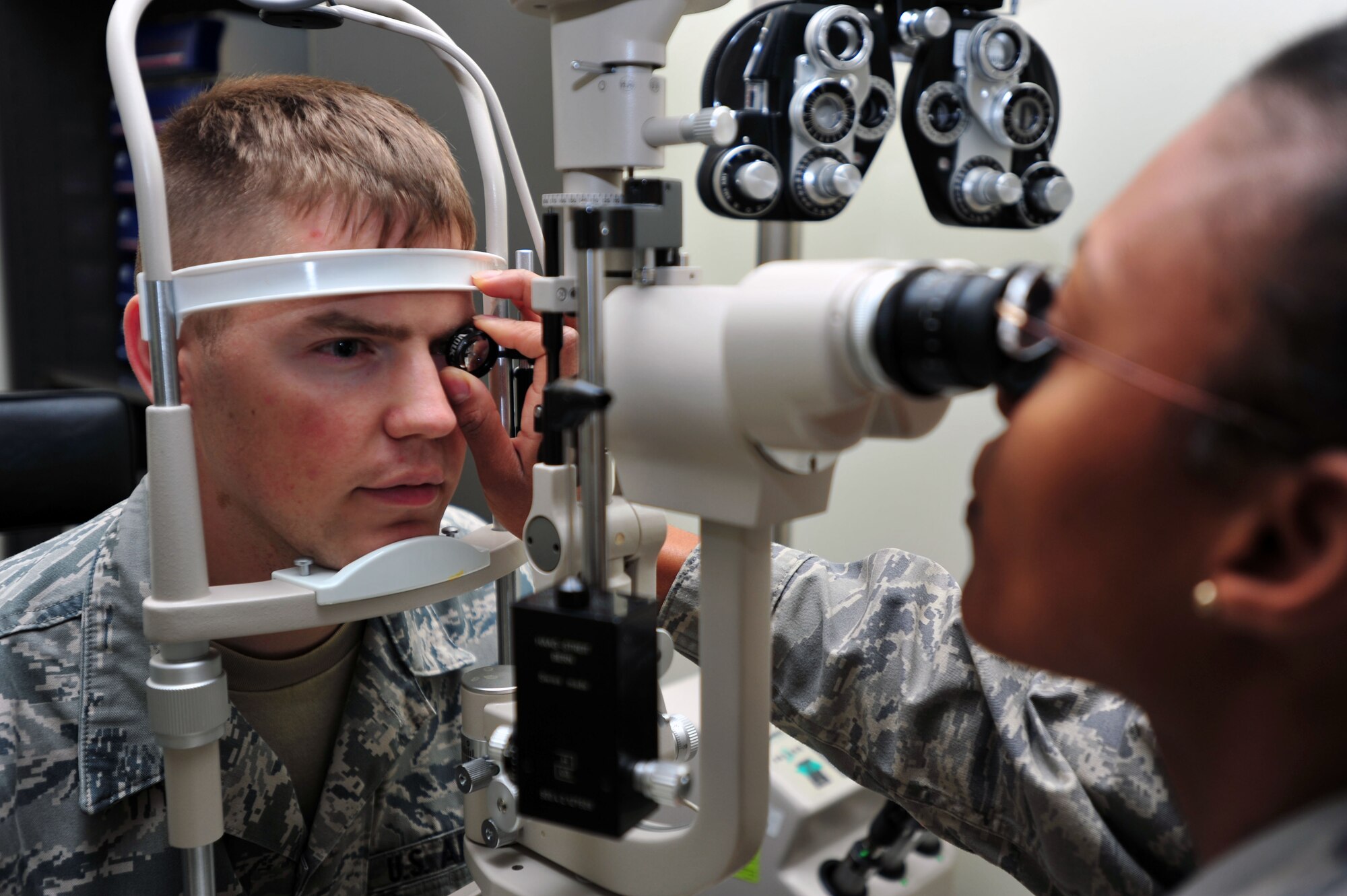 Senior Airman Robert Coleman, 303rd Intelligence Squadron cryptic linguist, receives an eye exam at the 51st Aerospace Medicine Squadron Optometry clinic at Osan Air Base, Republic of Korea, Oct. 24, 2012. The optometry flight’s mission is to ensure the base is provided with all the vision care needed to stay fit to fight. (U.S. Air Force photo/Airman 1st Class Alexis Siekert)