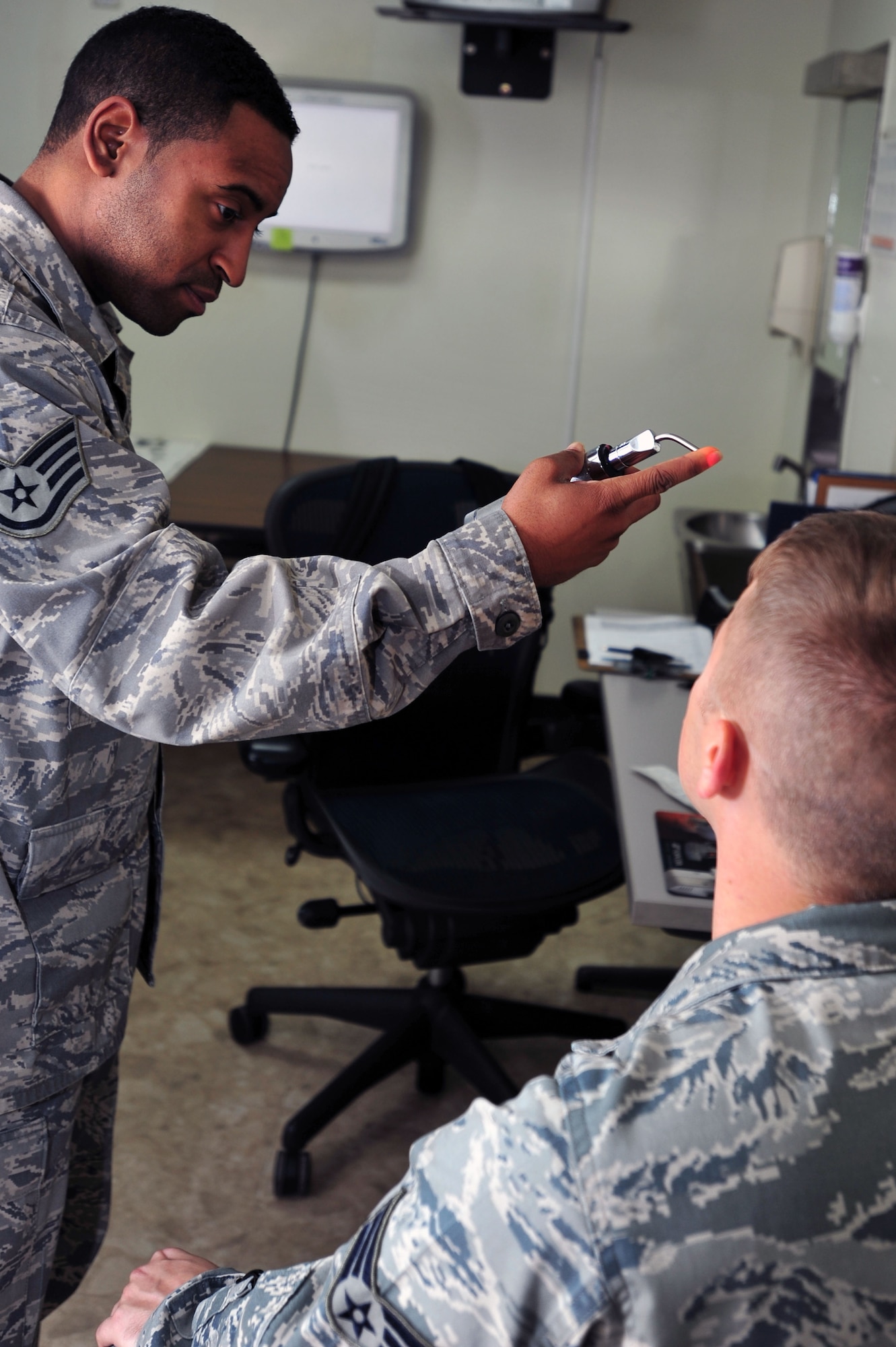Staff Sgt. Justin Wince, 51st Aerospace Medicine Squadron Optometry Flight NCO in charge, prescreens a patient before an eye exam at Osan Air Base, Republic of Korea, Oct. 24, 2012. The optometry flight’s mission is to ensure the base is provided with all the vision care needed to stay fit to fight. The team of four sees more than 65 patients a week. (U.S. Air Force photo/Airman 1st Class Alexis Siekert)