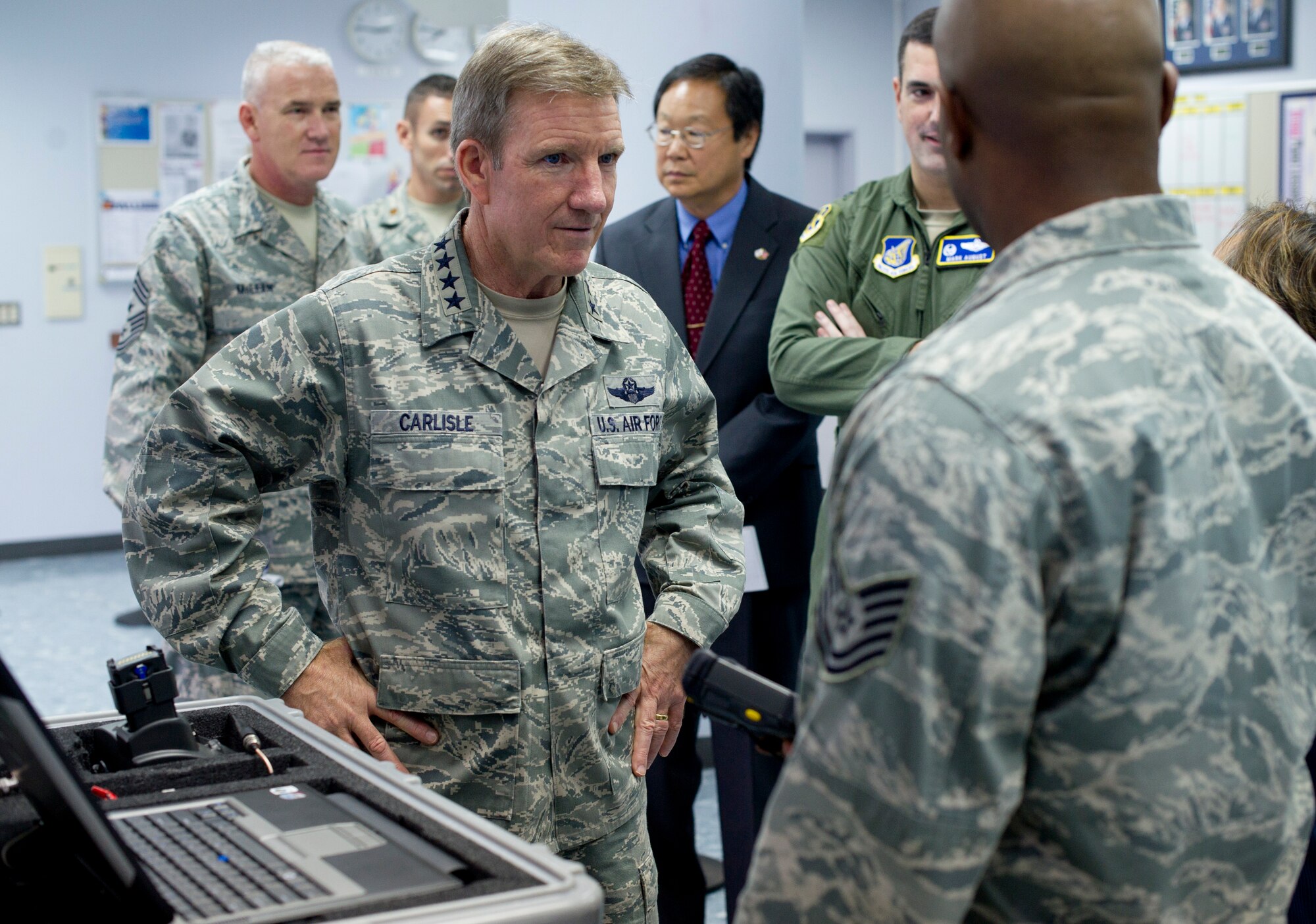 YOKOTA AIR BASE, Japan -- Gen. Herbert J. "Hawk" Carlisle, Pacific Air Forces commander, learns about the Noncombatant Evacuation Operations Tracking System during his visit to Yokota Air Base, Japan, Oct. 23, 2012. The tracking system allows bases to maintain accountability of evacuees and make sure they arrive at their destination. (U.S. Air Force photo by Staff Sgt. Stacy Moless)